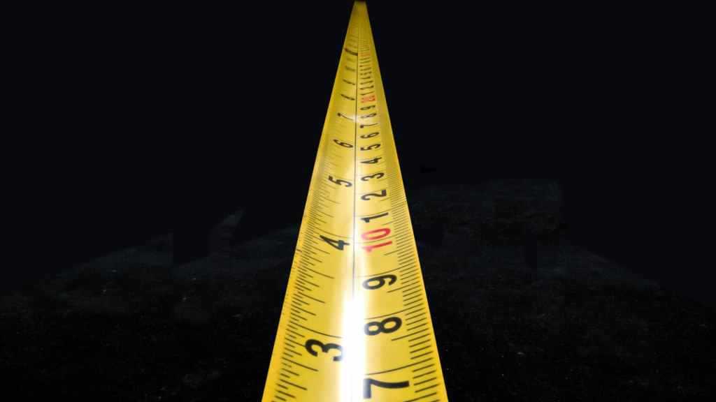 A tape measure extends into the unknown, representing the need to measure SEO success for effective strategy evaluation.