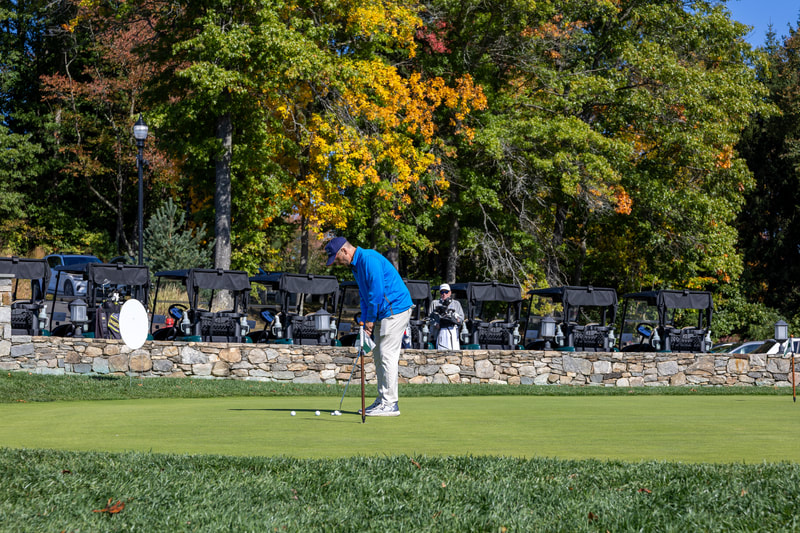 A golfer participating in a Chamber golf tournament